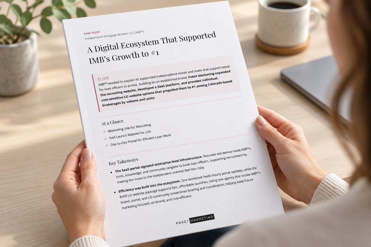 A reader holding the IMB™ case study, with the front cover visible.